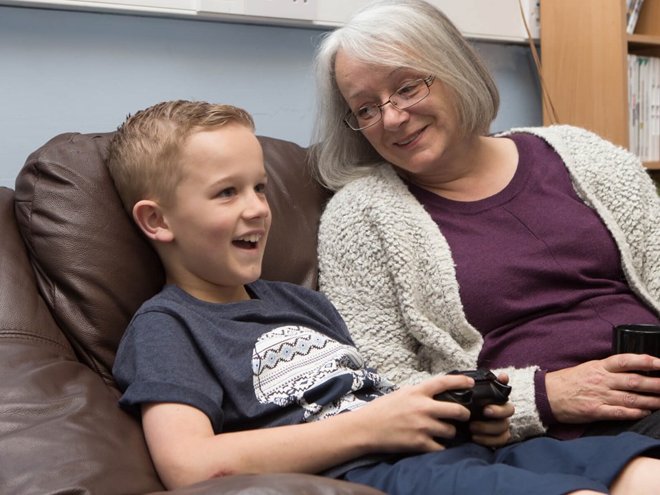 Woman and Boy Playing Video Games